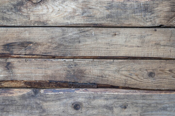 An old wooden backgroond. Wooden table top view . Aged wood planks background . Horisontal orientation wooden planks background . Wooden texture . 