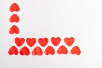 A red-hearted design made of paper on a white background.