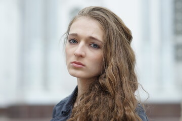 Fototapeta premium Portrait of a young beautiful girl in the park