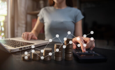 Business women using calculator with computer laptop, Business accounting, budget and loan paper in office.