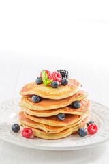 American pancakes with maple syrup and berries. Pancakes for breakfast.