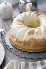 Pudding. Cottage cheese coffee chocolate dessert. Jelly. White cupcake on the table. Sweet pudding is round with a hole in the center. Still life on the table. Breakfast