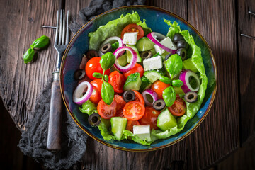 Greek salad with feta cheese, black olives and lettuce