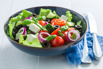 Greek salad made of fresh ingredients. Healthy spring salad.