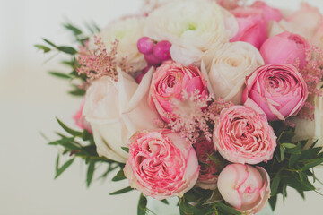 Roses and ranunculus flowers bouquet close up