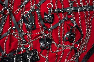 A set of erotic toys for BDSM. Sex slavery game with whip, gag and leather face mask. Intimate sex...