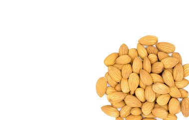 Raw almond pile on white background. Natural organic nut kernel. Protein superfood or healthy snack. Almond pile scattered on white table top view. Golden almond package design. Healthy eating banner