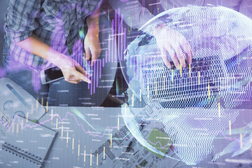 Multi exposure of man and woman working together and forex graph hologram drawing. Financial analysis concept. Computer background. Top View.