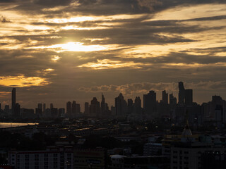 Fototapeta premium Sunset behind city