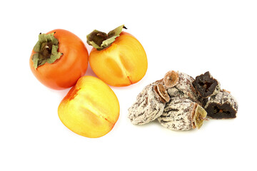 Persimmon or kaki fruit and sundried persimmoon isolated on white background.