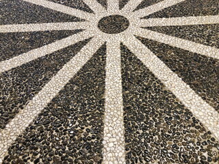 Black and white stone decorate on floor and walkway.