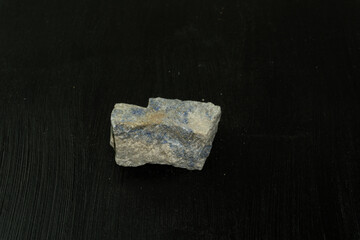 Lazurite from Pakistan. Natural mineral stone on black background. Mineralogy, geology, magic of...
