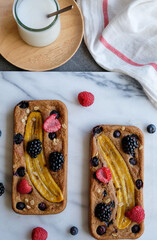 Delicious and healthy homemade meal / Banana Bread with Assorted Berries, Mixed Nuts and Yogurt /...
