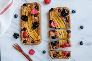 Delicious and healthy homemade meal / Banana Bread with Assorted Berries, Mixed Nuts and Yogurt /...