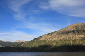 incredible view on lake called windy arm, and surrounding mountains in canadian wilderness, path...