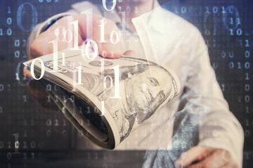 Double exposure of technology drawing hologram and us dollars bills and man hands. Data concept