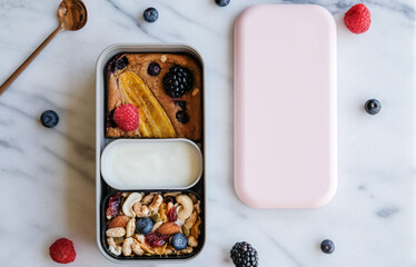 Delicious and healthy homemade meal / Banana Bread with Assorted Berries, Mixed Nuts and Yogurt /...