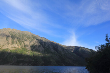 incredible view on lake called windy arm, and surrounding mountains in canadian wilderness, path...