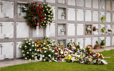 Fototapeta na wymiar Flowers placed in front of a grave in La Coruna, Spain