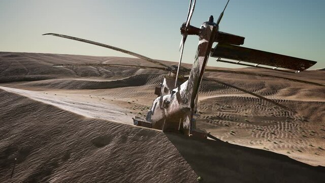 old rusted military helicopter in the desert at sunset