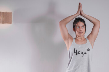 Woman meditating in yoga studio