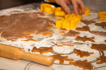 Cooking gingerbread, Women's hands cut out shapes with a pattern for cookies