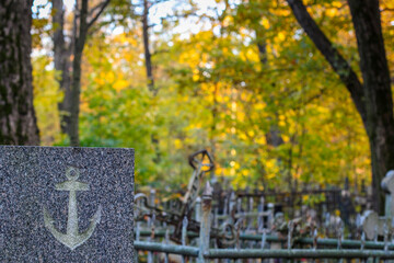 Grave of a sailor. Gravestone with anchor. 