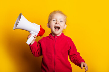 girl shouts holding a megaphone on a bright yellow background