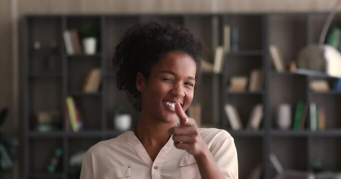 Head shot happy millennial african american woman pointing finger looking at camera, making choice, you are right, good idea concept. Smiling multiracial female hr manager making job offer, recruiting