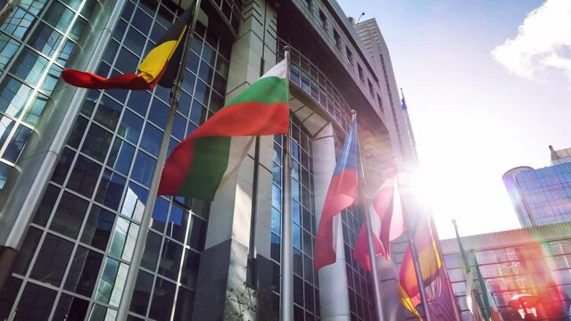 EU members flags waiving in front of European Parliament, 4K. Brussels, Belgium