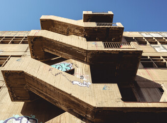 Tel Aviv, Israel - March 26, 2021: Old abandoned building with stairs and wall art in Tel Aviv