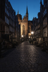 Fototapeta premium Night view of the githic St. Mary's church on Mariacka street, Gdańsk, Poland.