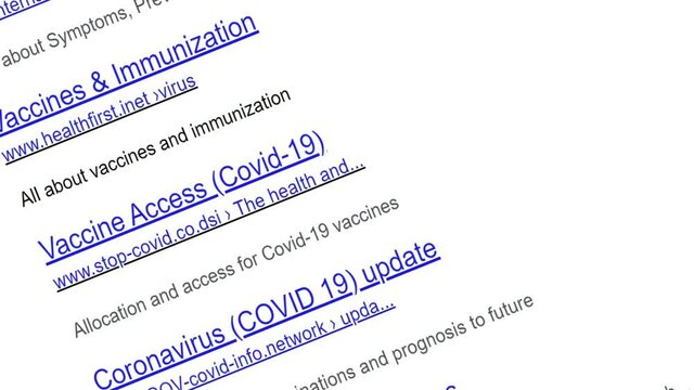Internet search results for coronavirus with The links of imaginary no-existing websites move on a display, close up.