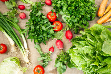 Vegetable heap on wooden background.