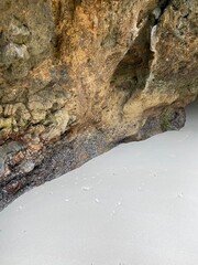 eroded cliff face on beach in thailand close up