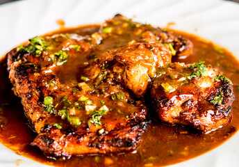 Fried  chicken breast with red wine sauce in plate , in door  Chiangmai  Thailand