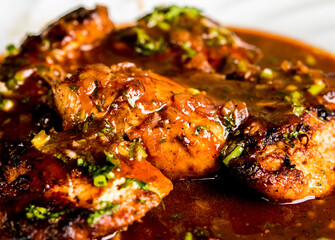 Fried  chicken breast with red wine sauce in plate , in door  Chiangmai  Thailand
