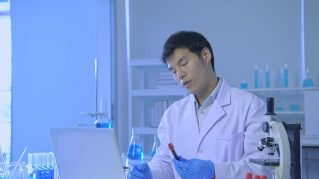Research concept of 4k resolution. Scientists are communicating about vaccines through computers.