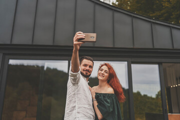 Front view of young family couple having fun and online meeting 