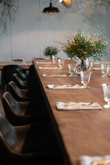 Fresh flowers bouquet on wooden served table.