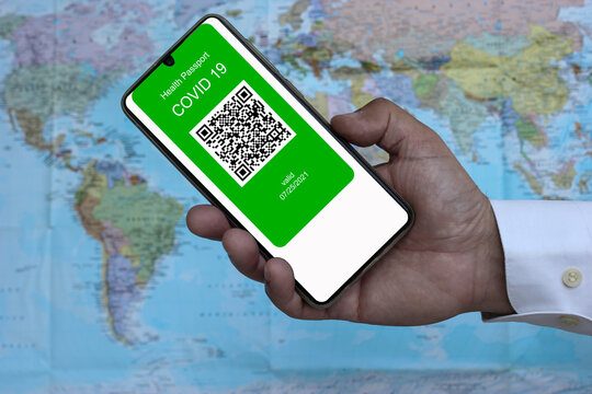 Covid 19 immunity passport on smartphone with QR code, to travel covid free
