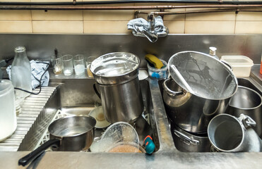 metal dishes in the sink, readz for dish washer