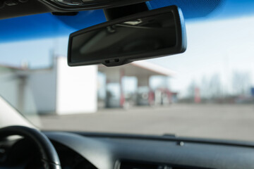 Rearview mirror inside the car.