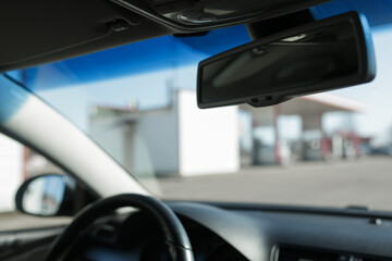 Rearview mirror inside the car.