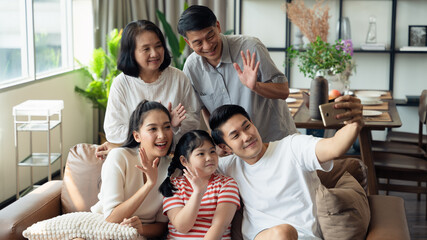 Enjoy family taking selfies using mobile phone with smile and laughter, family portrait, quality time, grandparents and granddaughter