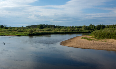 Wide river Klyazma in the middle of Russia in the hot summer.