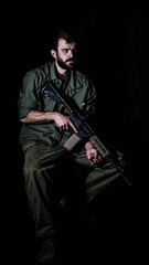 Naklejka premium Portrait of an American Army veteran holding an AR15 Rifle.