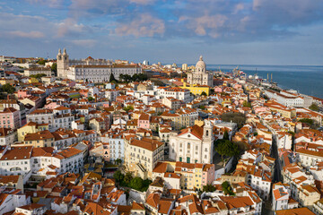 Aerial drone view over Alfama District, Lisbon, Portugal. Lockdown cityscape. National Pantheon in the background.