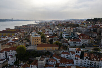 Aerial drone view over Alfama District, Lisbon, Portugal. Lockdown cityscape. Commerce plaza in...