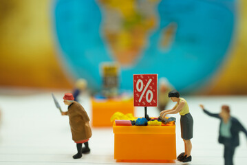 Miniature people: Shoppers housewife selecting shopping salesman calling customer discounted items in discount tray best selling using as background commercial retail business concept.